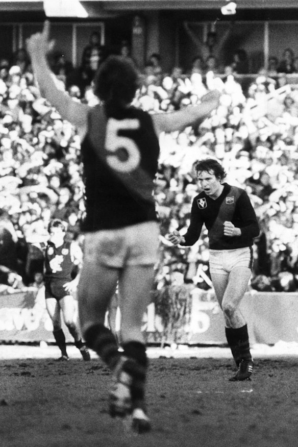 Neale Daniher (right) sees his brother Terry Daniher celebrate after scoring the game-saving goal at Princes Park in 1981.