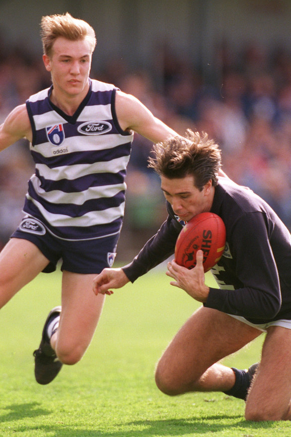 Stephen Silvagni marks in front of Darren Milburn.