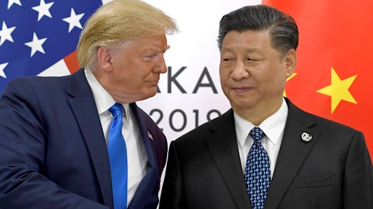 Donald Trump, pictured here with Xi Jinping in 2019, is obsessed by China, Bolton says.