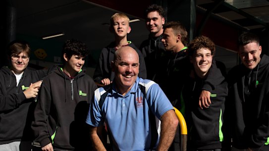 Andrew Horsley with Dapto High School students, is a mentor to the boys.