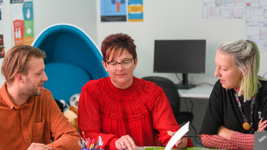 Hester Hornbrook Academy principal Sally Lasslett (centre) with teacher Eric Woodward and youth worker Felicity Gibbons.