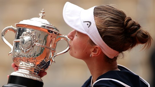 Match winner Barbora Krejcikova of Czech Republic kisses the winners trophy after her win. 