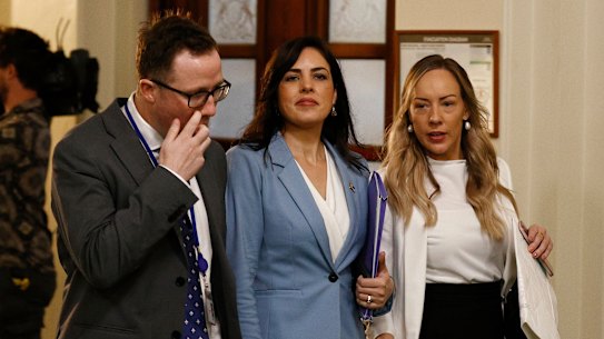 Victorian Liberal MP Moira Deeming (centre) shortly before the party room meeting in which she was suspended on March 27.