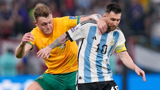 Harry Souttar tangles with Lionel Messi during the Socceroos’ round-of-16 loss to eventual champions Argentina in Qatar.