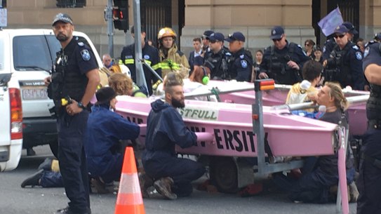 About 20 police were working to move the boat, at the Elizabeth and George streets intersection in Brisbane.