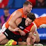 Kieren Briggs of the Giants tackles Sam Durham of the Bombers.