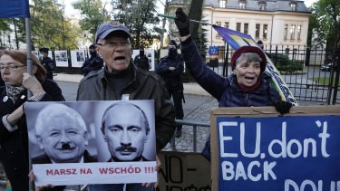 People stage a protest in front of Poland’s constitutional court, in Warsaw. Poland’s constitutional court has ruled that some European Union laws are in conflict with Poland’s Constitution. 