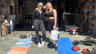 Sally Dominguez, right, and her daughter Olivia, at their makeshift home gym in San Francisco.