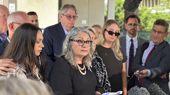 The families of Rachel McCrow and Matthew Arnold, led by Judy McCrow, outside Brisbane Magistrates Court after State Coroner Terry Ryan handed down his findings into the Wieambilla ambush.