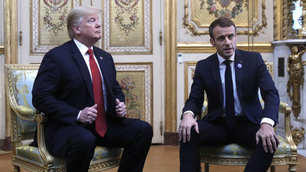 President Donald Trump meets with French President Emmanuel Macron inside the Elysee Palace.