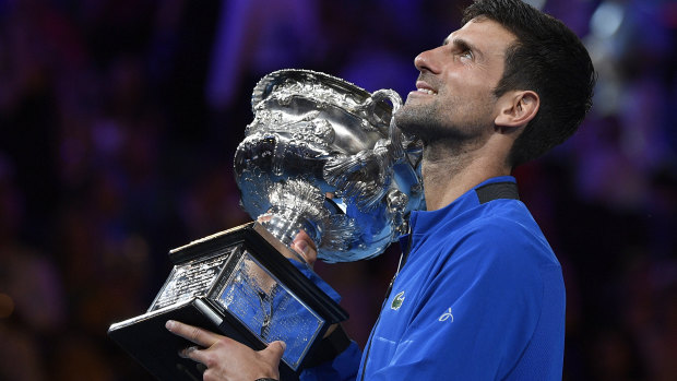 Higher vision: Djokovic holds up the Australian Open trophy.