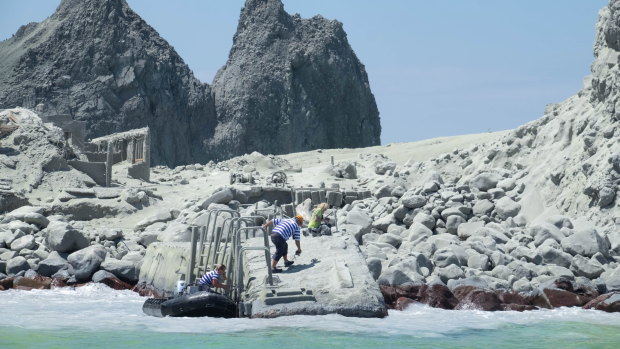 An image provided by visitor Michael Schade shows tourists and tour guides fleeing White Island (Whakaari) volcano.