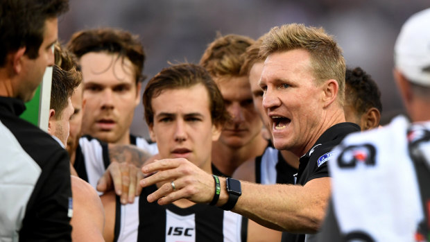 Collingwood coach Nathan Buckley shows the way forward for the Magpies.