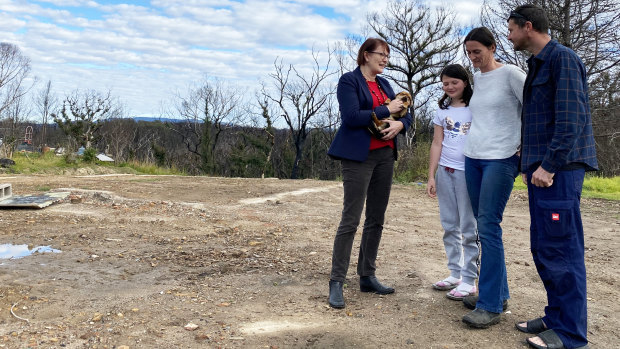 Labor MP for Macquarie Susan Templeman speaks with Keira, Megan and Chris Kezik, who lost their Bilpin home to December's bushfires.