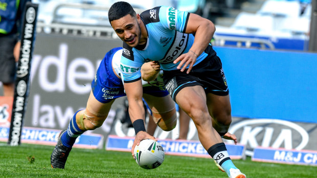 Hot to trot: Valentine Holmes scores a try to go with the three he set up on Sunday. 