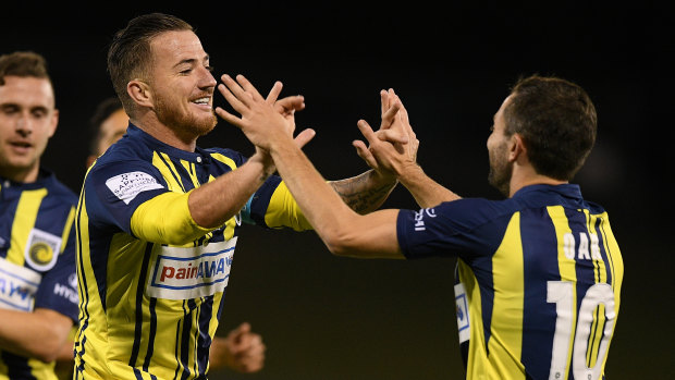 New faces: Ross McCormack  (left) celebrates with Tommy Oar during a pre-season outing for the Mariners.