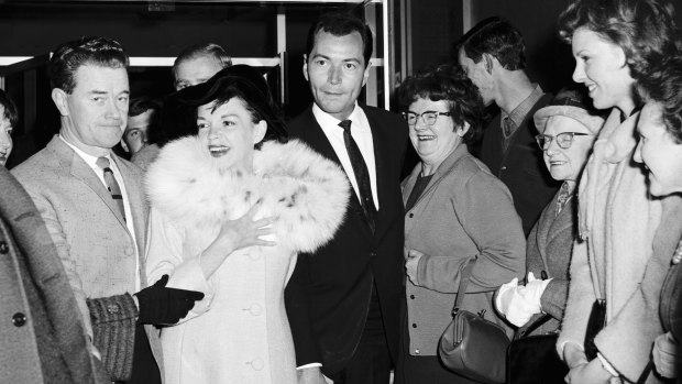Miss Garland and her entourage leaving the Southern Cross Hotel.