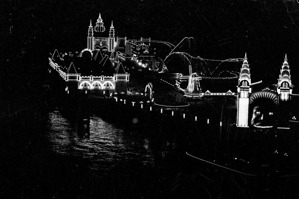 "At night the buildings are outlined with lamps and the grounds brilliantly illuminated." Luna Park on October 8, 1935.