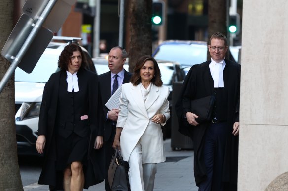 Lisa Wilkinson and her legal team outside the Federal Court in Sydney on Monday.