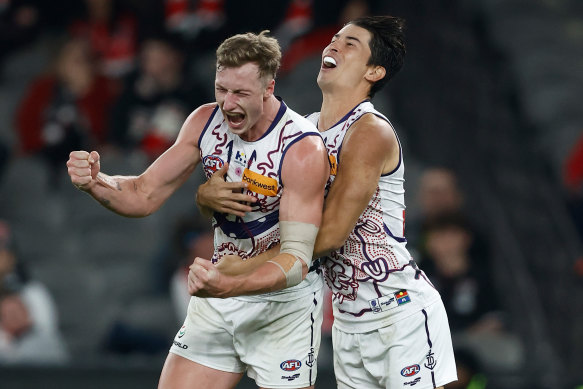 Josh Treacy (left) and Bailey Banfield of the Dockers celebrate a goal.