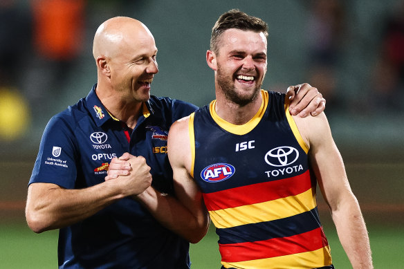 Crows midfielder Brad Crouch (right) with coach Matthew Nicks after the win over the Giants.