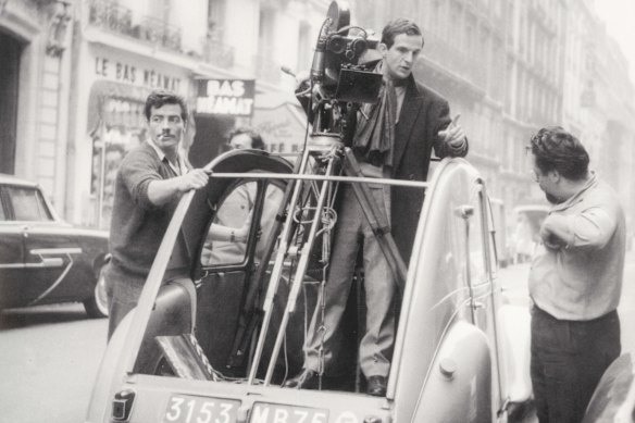 Francois Truffaut directing a scene during filming of <i>Le Peau Douce</i> (Soft Skin) in 1964