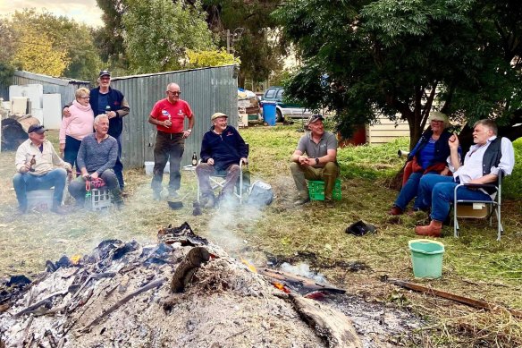 Cliff Lockwood (far right) and John Stubbs (seated, second from left) at the working bee organised at Lockwood’s home.