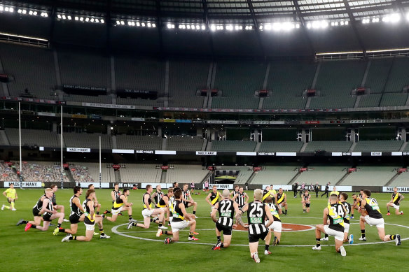 Taking the knee, as Collingwood and Richmond did at this AFL game in June, has become so commonplace that not taking it is now arguably the more overtly political gesture.