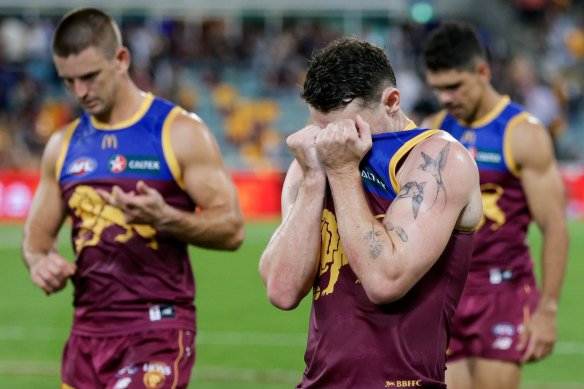 The aftermath: A dejected Lachie Neale leaves the field.