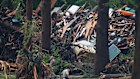 Officials comb through the banks of the Guadalupe River after the weekend’s fatal flash floods. 