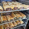 Homemade sausage rolls are available in the cabinet.