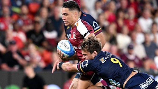 Kalani Thomas on the rampage for the Reds against the Highlanders.