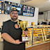 Mitchell holding their gourmet sausage roll trophy.