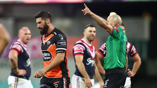 James Tamou is marched by Ben Cummins.