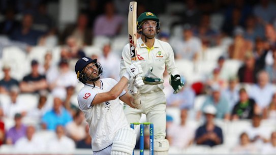 England’s Mark Wood plays a ball bowled by Australia’s Todd Murphy and is caught out by Mitchell Marsh.