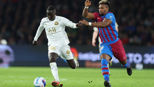 Garang Kuol holds off Barcelona’s Adama Traore on Wednesday night.