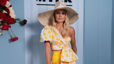 Myer Ambassador Elyse Knowles wearing Acler and Millinery by Melissa Jackson poses during the Lexus Melbourne Cup Day.