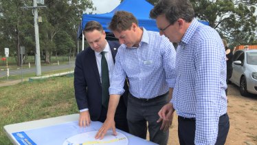 Brisbane lord mayor Adrian Schrinner, Bonner MP Ross Vasta and then-Cities Minister Alan Tudge talking over a $226 million “congestion-busting” package for south-east Queensland roads. 