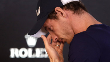 Britain's Andy Murray leaves a press conference to compose himself in Melbourne. 