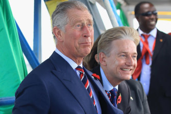 Prince Charles, left, shares a joke with Clive Alderton, his private secretary, on a ferry in Dar Es Salaam, Tanzania, in 2011..