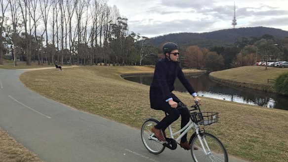ANU student Samuel Bashfield tries out one of the Airbikes along Sullivans Creek