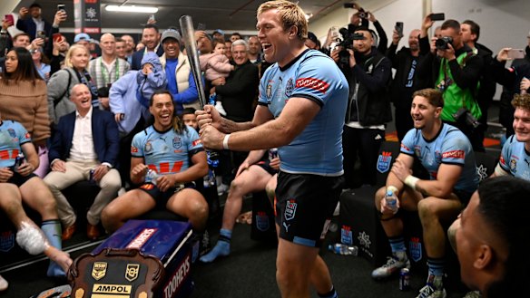 Jake Trbojevic wields Michael Maguire’s famous baseball bat after NSW’s State of Origin series win.