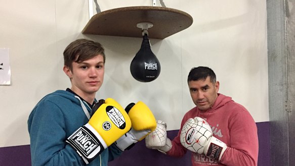 Yass teenager Adriaan Roodt, left, with boxing coach Spider. Adriaan, a student at Campbell High, was tragically killed in an accident on Mount Ainslie this week.