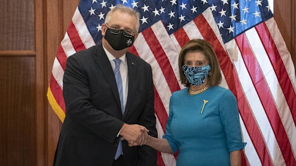 Australian Prime Minister Scott Morrison, left, shakes hands with US House Speaker Nancy Pelosi.