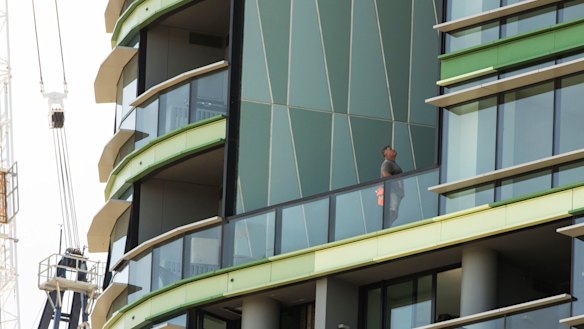 Tradesmen working on Opal Tower in Olympic Park.
