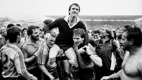 Wallabies captain Andrew Slack is chaired from the Eden Park turf by Michael Lynagh and Simon Poidevin following the 22-9 win.