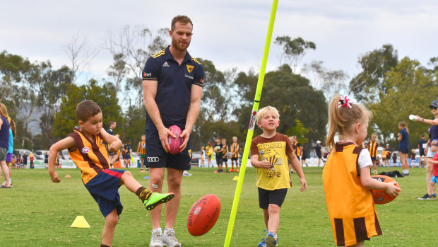 Hawthorn's Tom Mitchell at a football clinic on Tuesday.