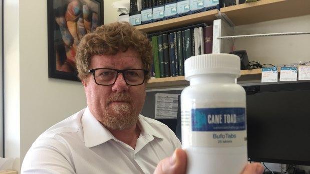  Professor Rob Capon from University of Queensland's Institute of Molecular Bioscience, with his bottled cane toad baits.