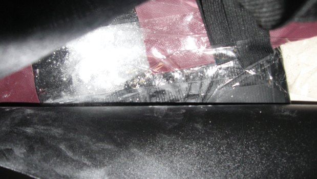 The cocaine was allegedly concealed in the suitcase\'s lining.