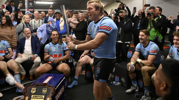 Jake Trbojevic wields Michael Maguire’s famous baseball bat after NSW’s State of Origin series win.
